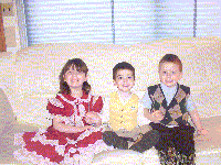 Amanda, Devon and Breighton dressed up and sitting on the couch - March 2003